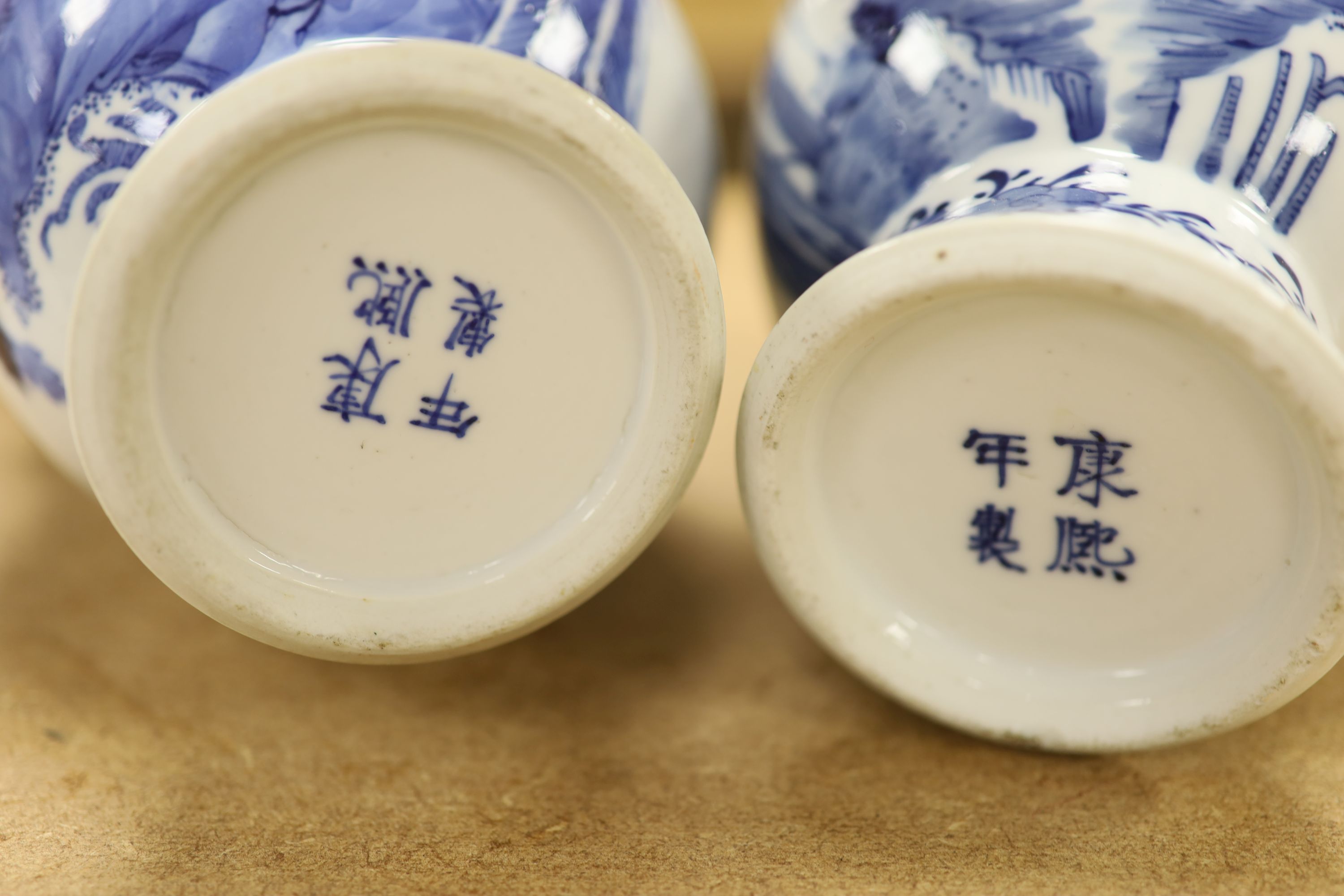 A pair of Chinese blue and white 'phoenix' vases, Kangxi marks but late 19th century, height 20cm (a.f.)